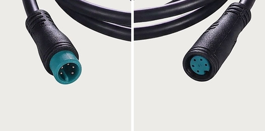 Close-ups of a 5-pin round waterproof plug: male plug on the left, female plug on the right