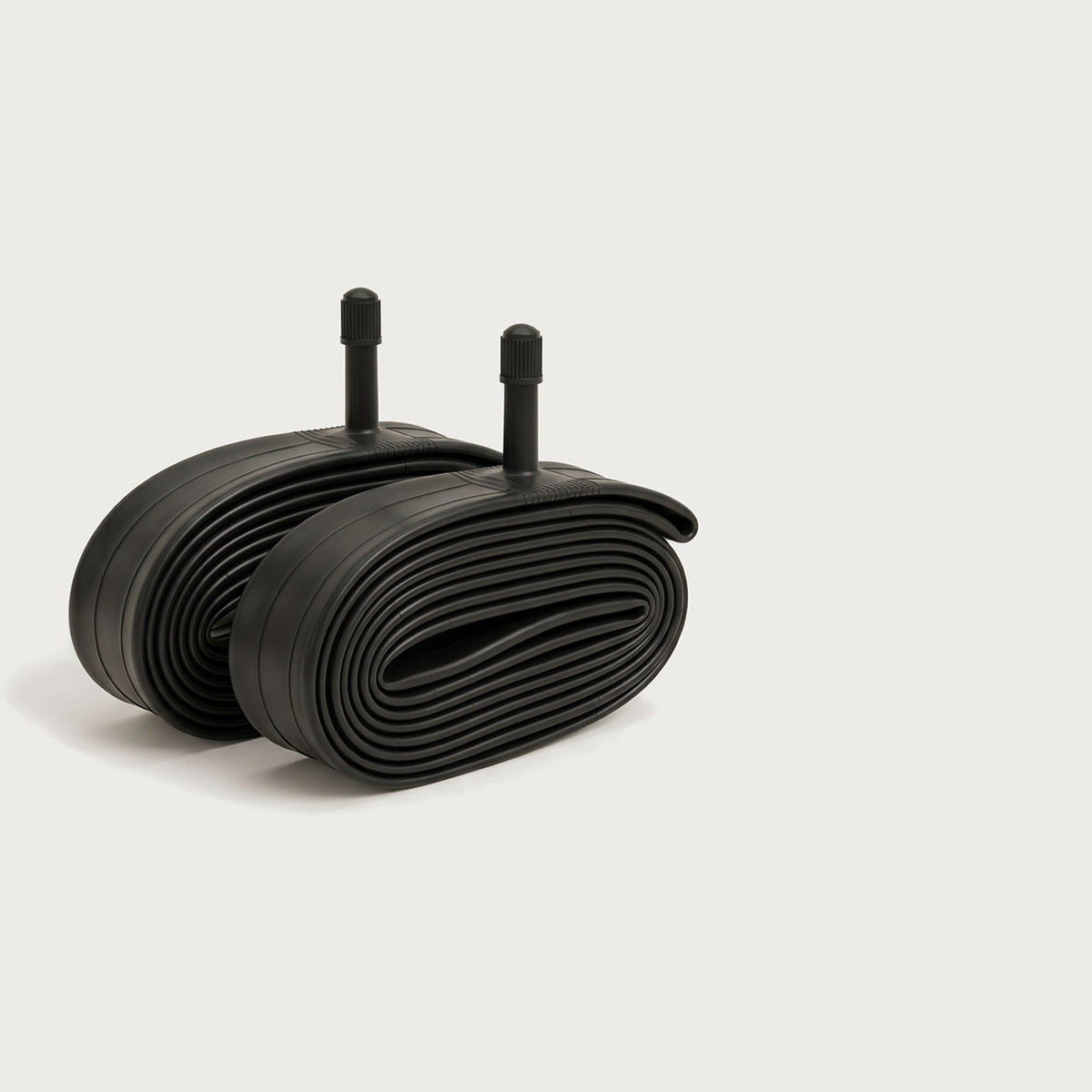 Two black heavy duty 26-inch bike inner tubes with Schrader valve stems