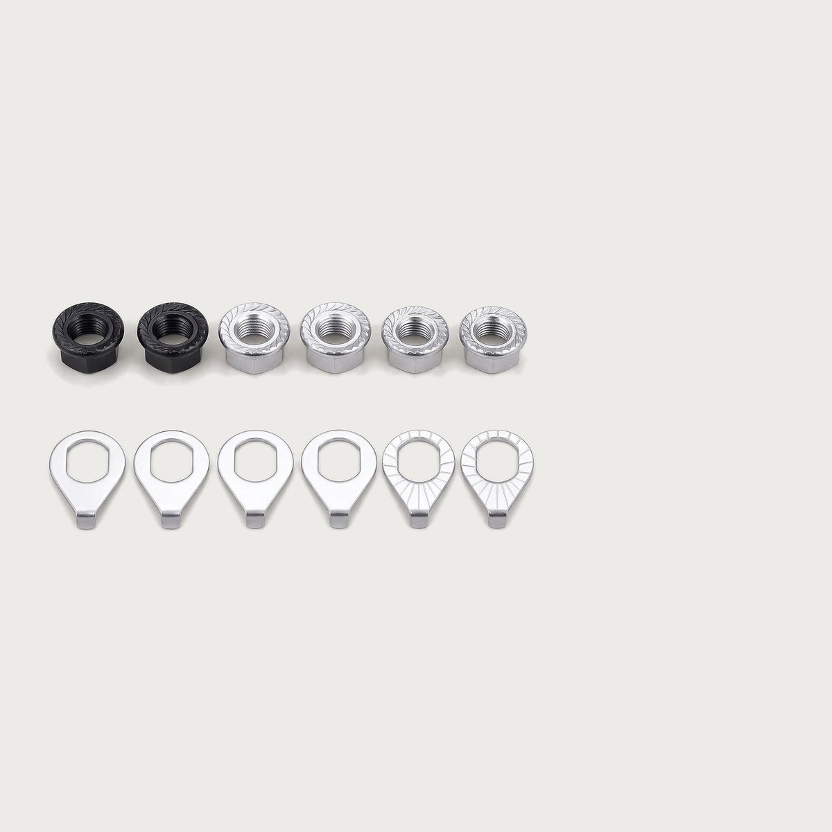 Set of serrated flange axle nuts, black and silver, with tab-style safety washers