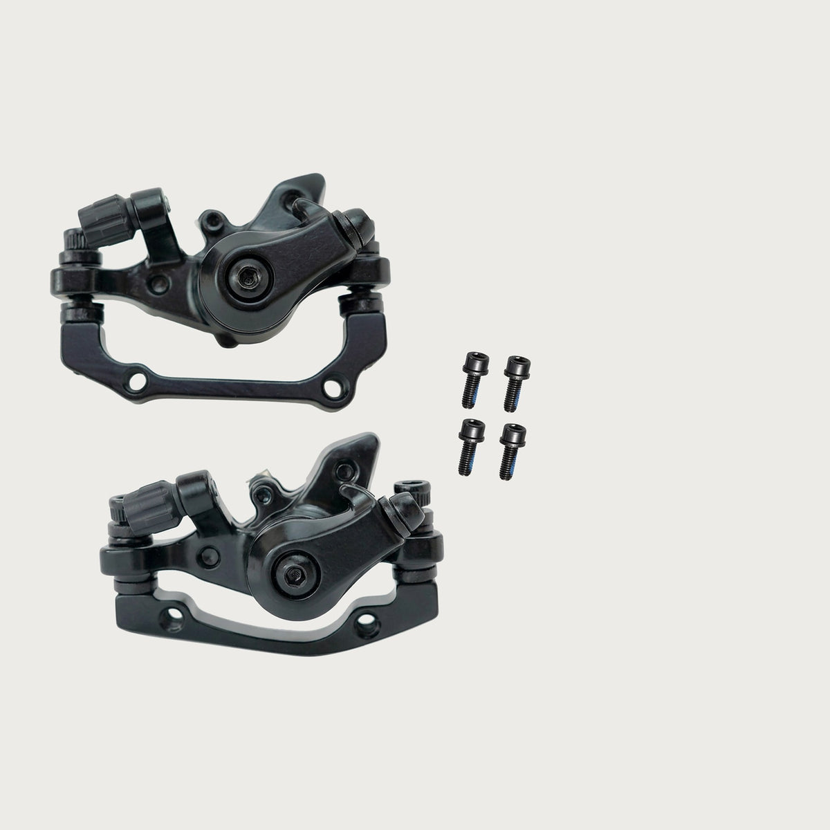 Pair of black aluminum mechanical disc brake calipers with mounting screws