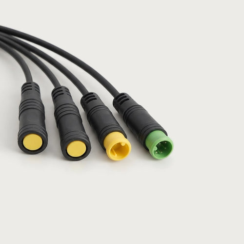 Close-up of the four waterproof branch connectors on the wiring harness
