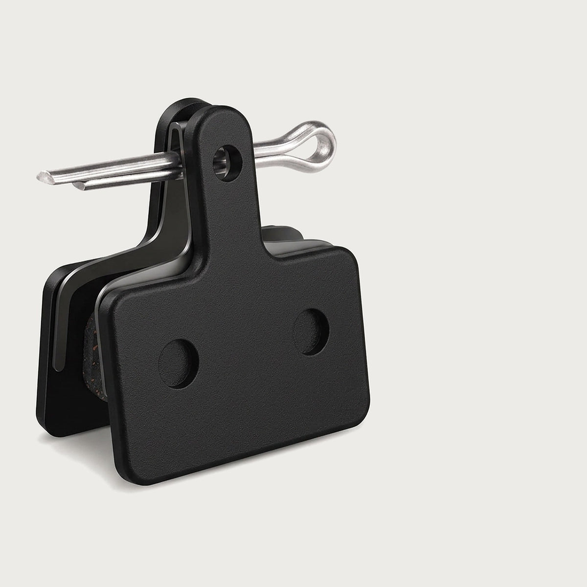 Pair of black semi-metallic disc brake pads with a split retaining pin