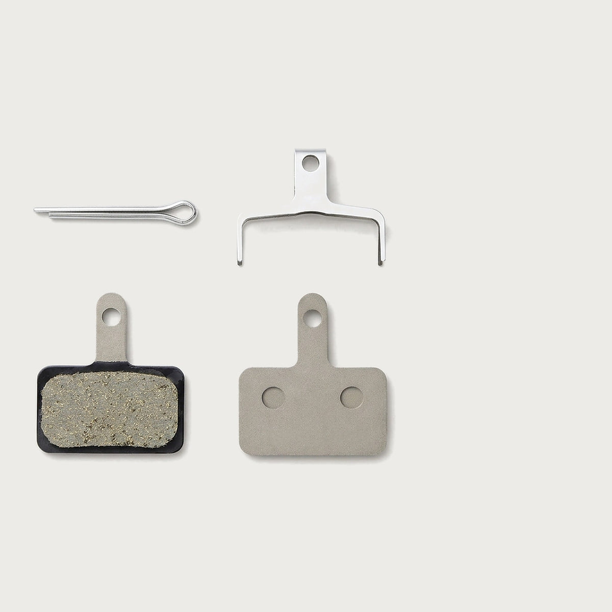 Pair of Shimano B05S-RX resin disc brake pads with spring and split pin