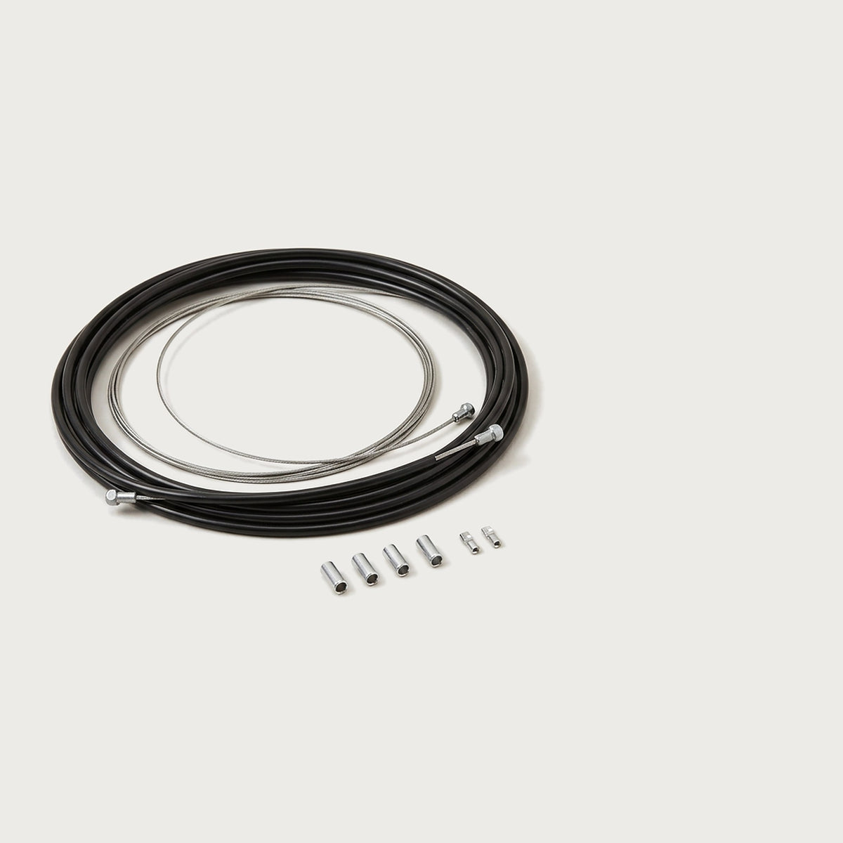 Black brake cable housing coil with stainless steel inner wires, ferrules and cable tips
