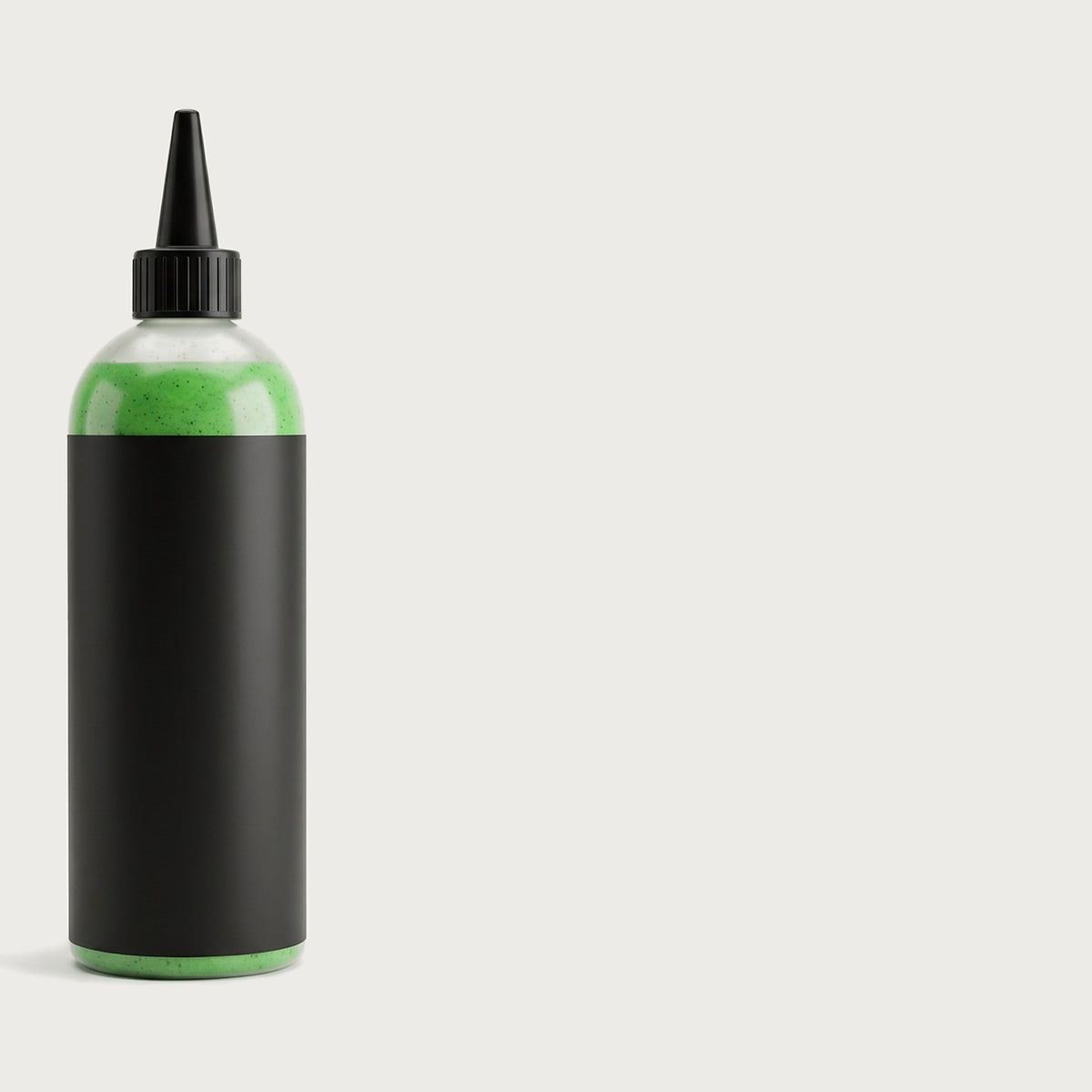 16 oz squeeze bottle of green tire and tube sealant with a black nozzle cap